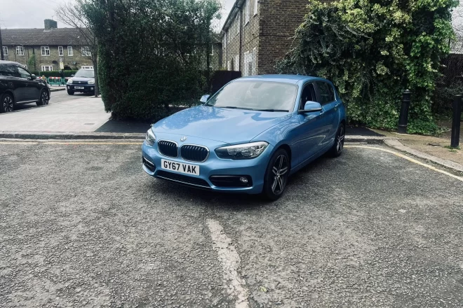 BMW 1 Series Sports in Blue Colour standing on ground