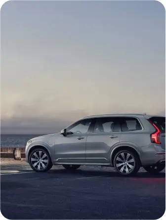 A sleek 2019 Volvo XC90 parked, showcasing its modern design and elegant lines in a scenic outdoor setting.