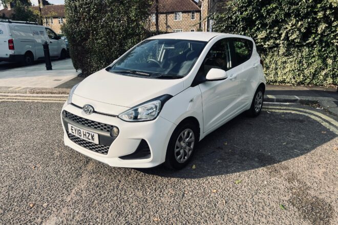 Hyundai i10 in white colour standing on the ground