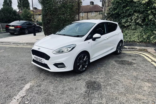 Hyundai i10 in white colour standing on the ground