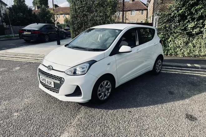 Hyundai i10 se 2019 in white colour standing on the ground