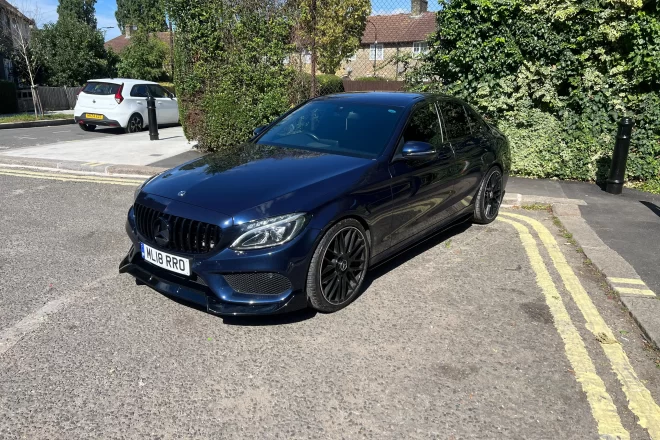 Mercedes Benz C220D AMG in blue colour standing on the groun