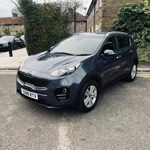 Kia sportage 2018 in blue colour standing on the ground