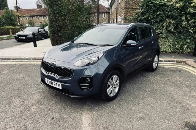 Kia sportage 2018 in blue colour standing on the ground