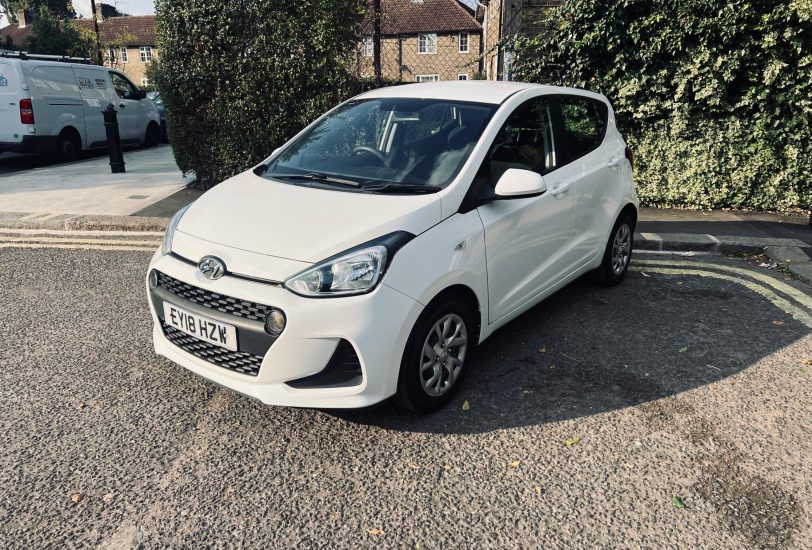 Hyundai i10 in white colour standing on the ground