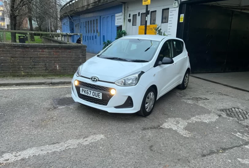 Hyundai i10 se 2017 in white colour standing on the ground