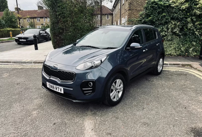 Kia sportage 2018 in blue colour standing on the ground