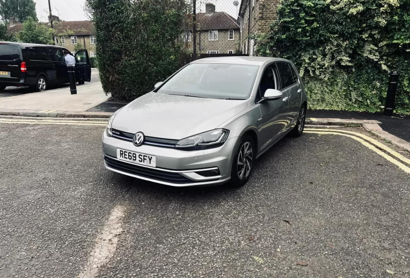 Volkswagen Golf in silver colour standing on the ground